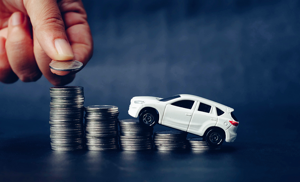 Small Toy Car balancing on coins